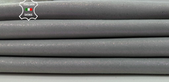 Two pieces of grey pearlized shimmer Italian goatskin leather, soft and thin, showcasing smooth texture and subtle shine.