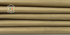 Two skins of Old Gold Washed Pearlished Veg Tan Goat Leather from ITALIANSKINS, showing textured leather with a natural finish.