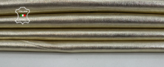 Shiny metallic platinum leather hide from Italianskins, soft lambskin vegetable tan leather, 8 sq ft, 1.0mm thick, close-up view.