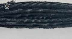 Black and grey fringed Italian lambskin leather skin from italianskins, showcasing soft, genuine lamb leather with fringed edges.