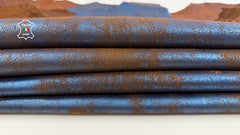 Metallic blue crackled distressed Italian lambskin leather skin with vintage stonewash finish, showcasing textured and aged leather details.