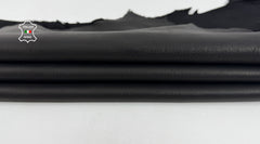 Black Italian kidskin goatskin leather from Italianskins, waterproof and fire resistant, showcasing smooth, high-quality leather skins.