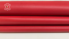 Red smooth Italian Metis Lambskin leather skins from Italianskins, showcasing high-quality genuine leather with a sleek, polished surface.