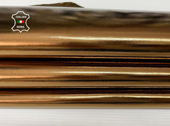 Shiny metallic bronze Italian lambskin leather skins with smooth texture and natural sheen, ideal for high-quality leather crafts.