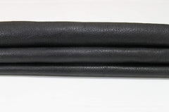 Black rough vegetable-tanned Italian goatskin leather skin by Italianskins, showcasing textured, genuine leather surface.
