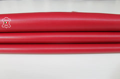 Raspberry red Italian lambskin leather hide from Italianskins, showing smooth, genuine genuine Italian lamb leather with natural texture.
